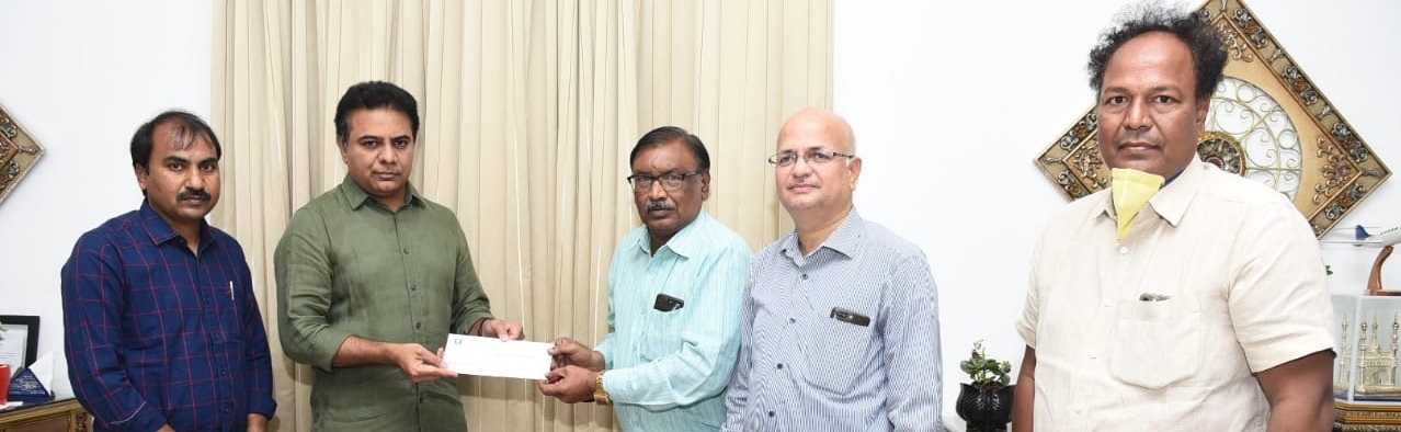 S NITIN, DIRECTOR KMIT, HANDING DONATION CHEQUE TO CM RELIEF FUND FOR COVID 19 TO HON' MINISTER SHRI KTR